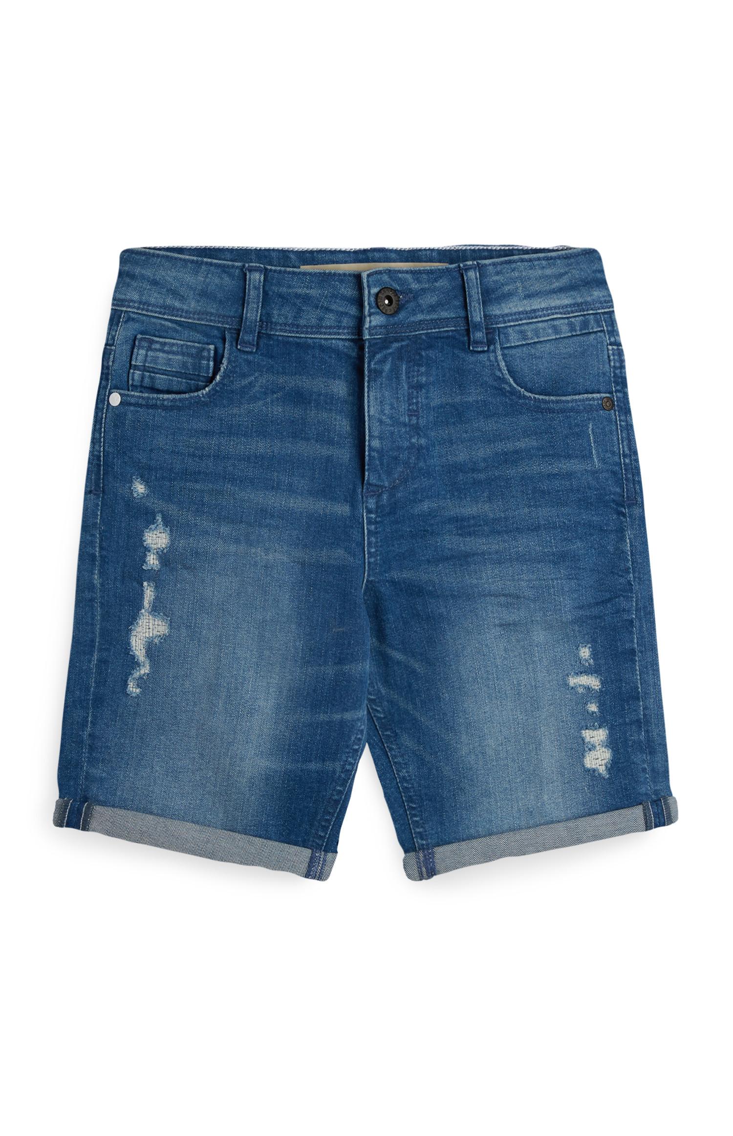 Shorts blu strappati da ragazzo