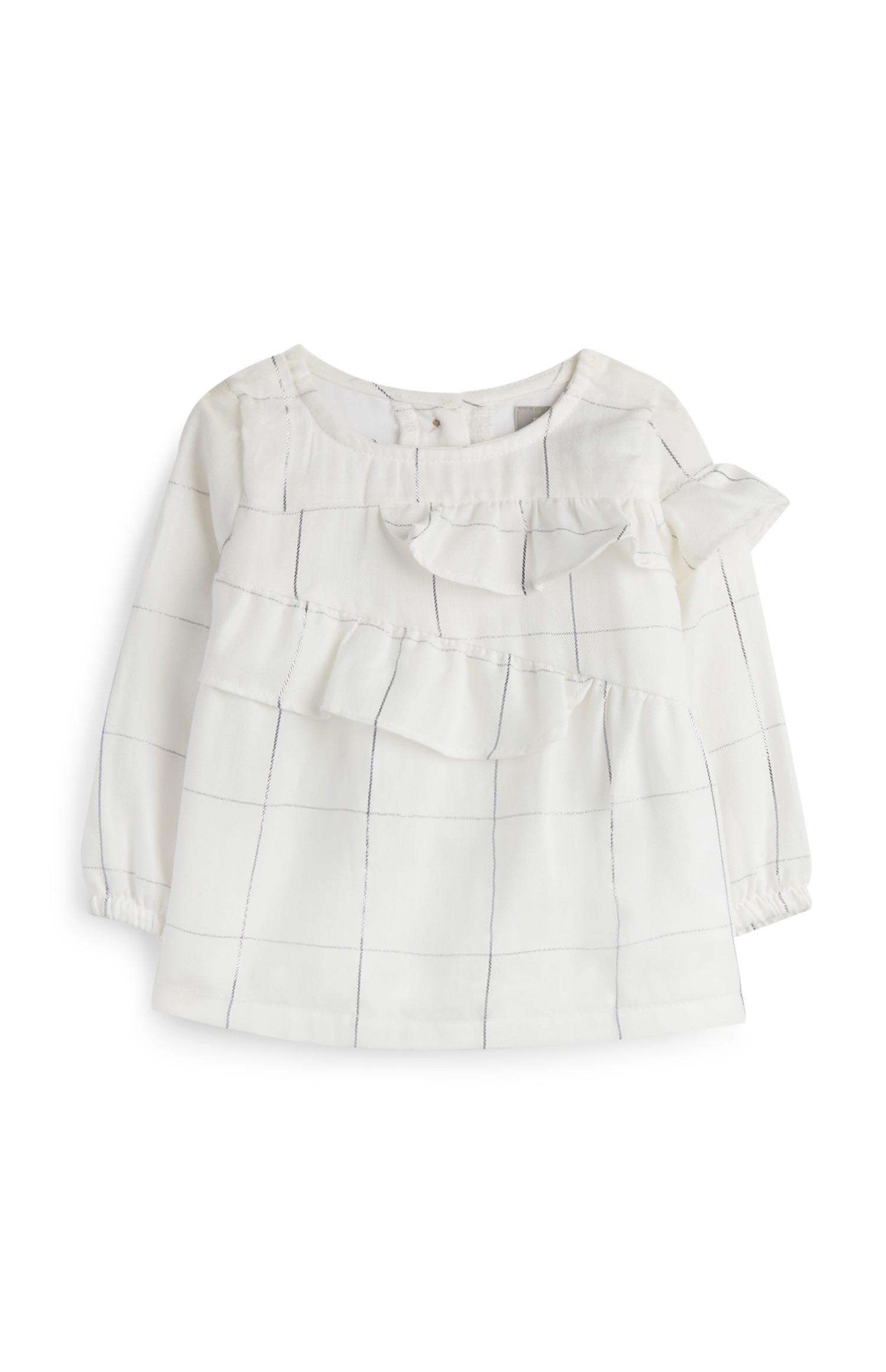 Blusa con volante para bebé niña