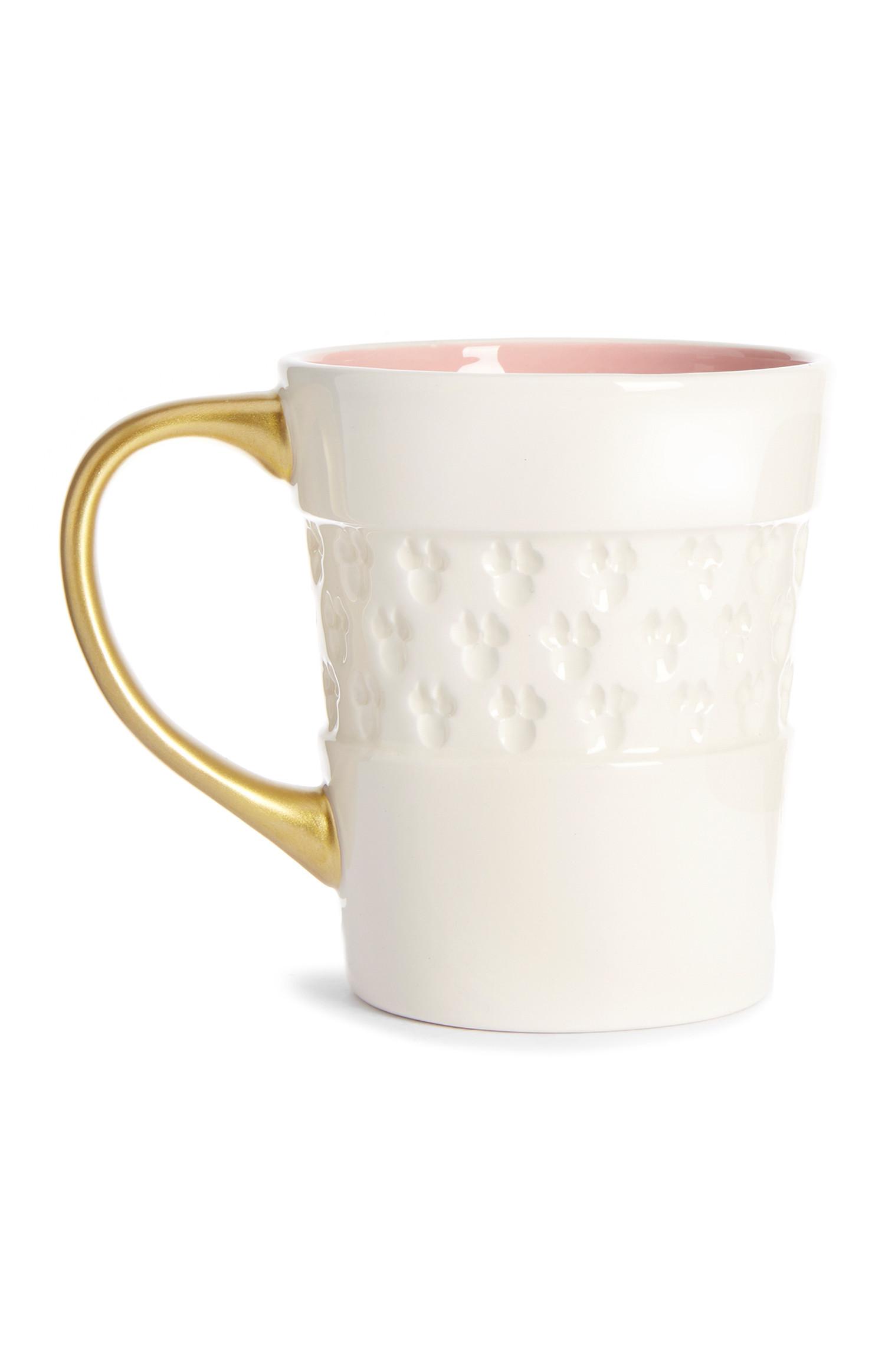 Bela skodelica z reliefnim vtiskom Miki Miška