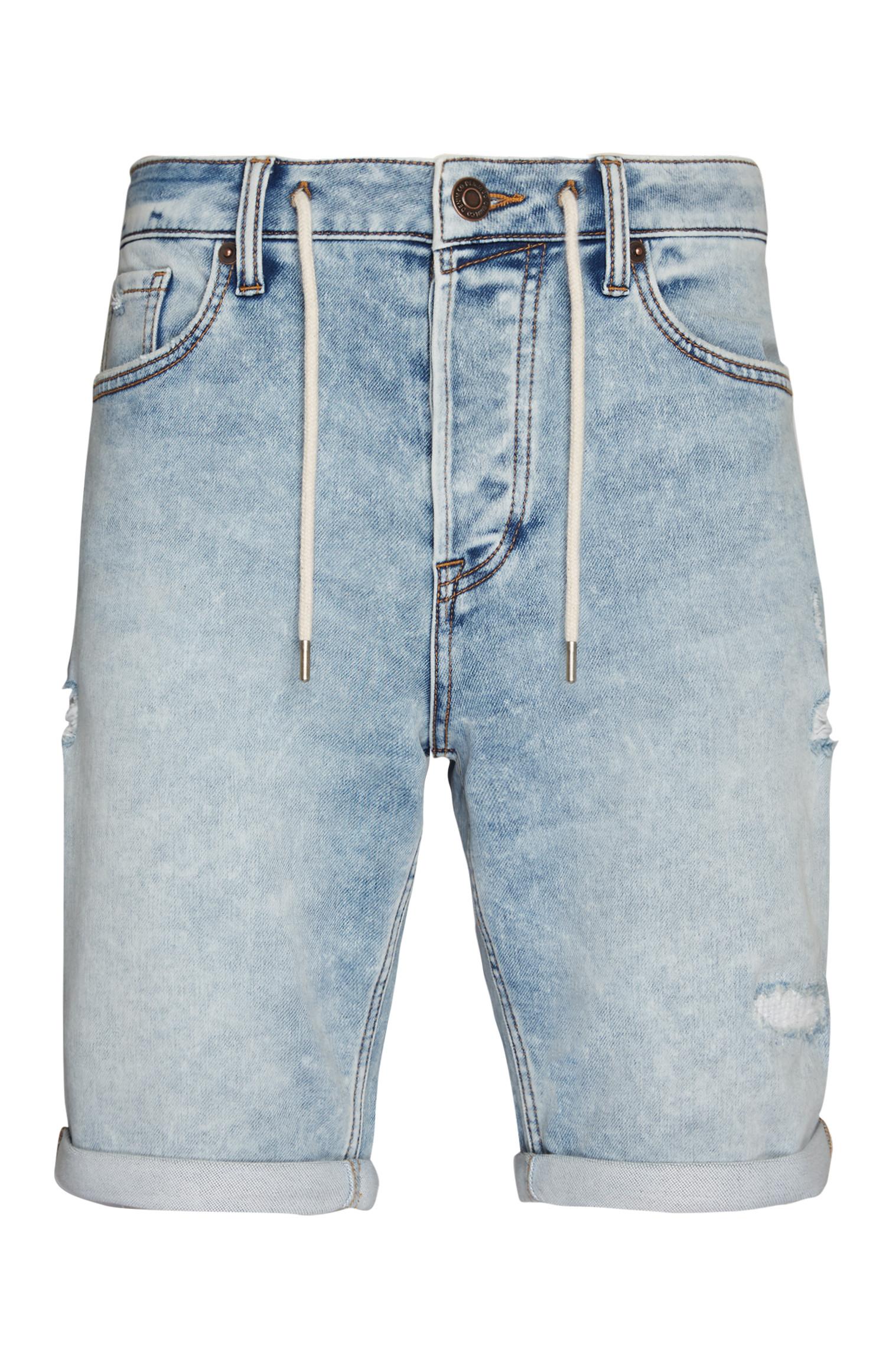 Shorts azzurri con coulisse in maglia, strappi e rammendi