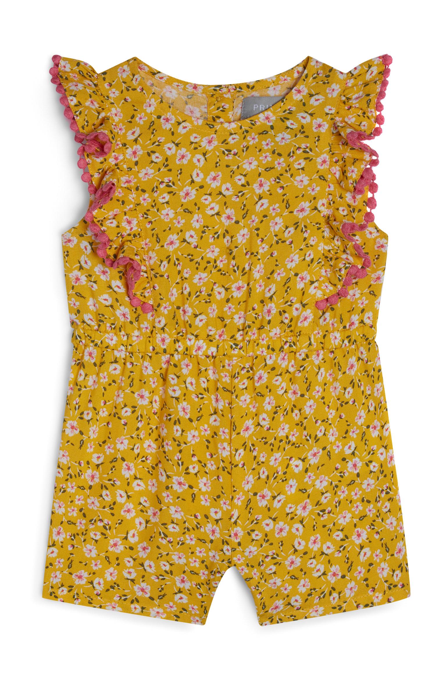 Tuta corta gialla in viscosa motivo floreale da bimba