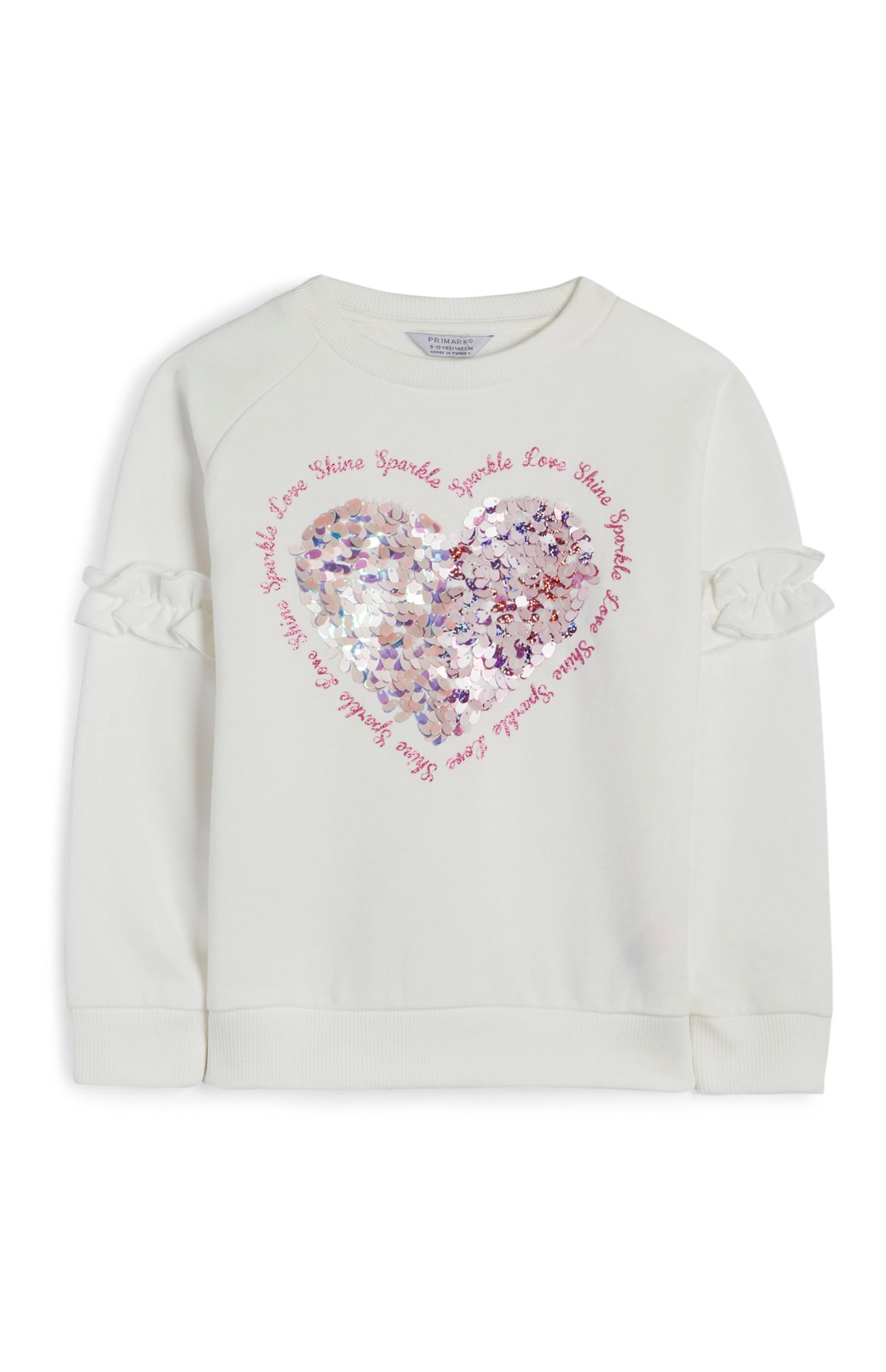 Jersey con corazón y lentejuelas color crema para niña pequeña