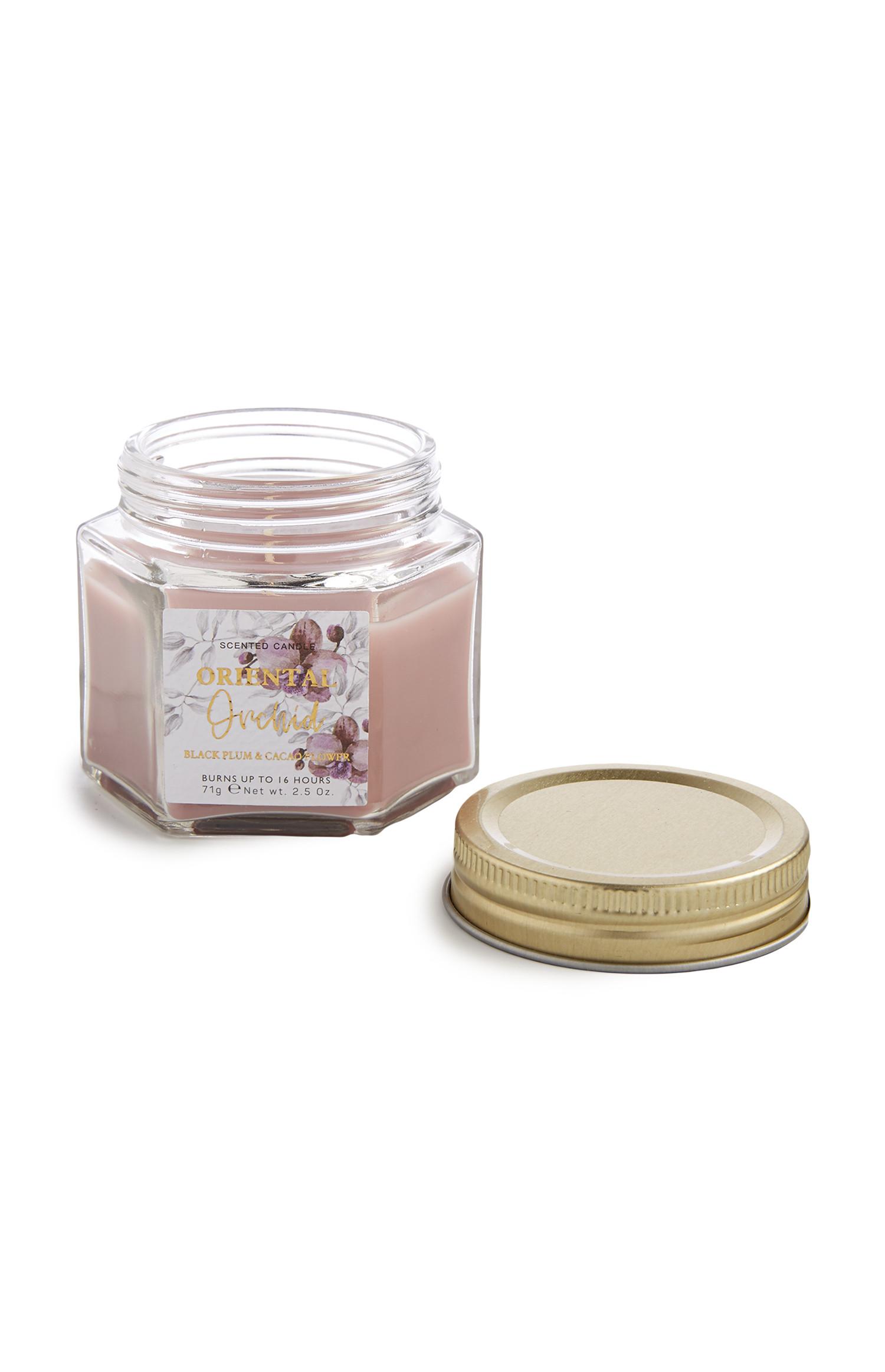 Dišeča sveča z aromo orientalske orhideje v steklenem kozarcu