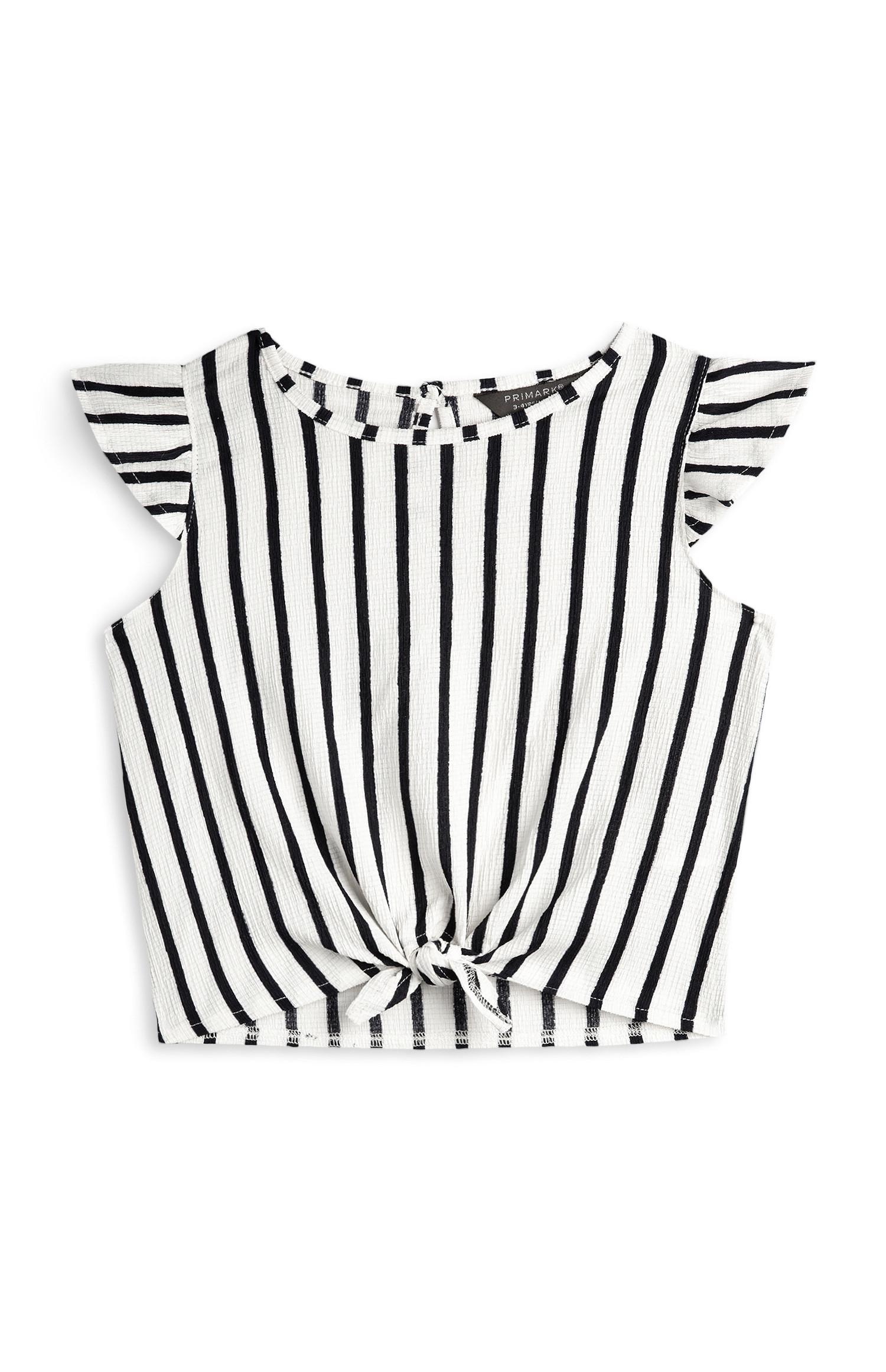 Top bianco e nero a righe annodato sul davanti da bambina