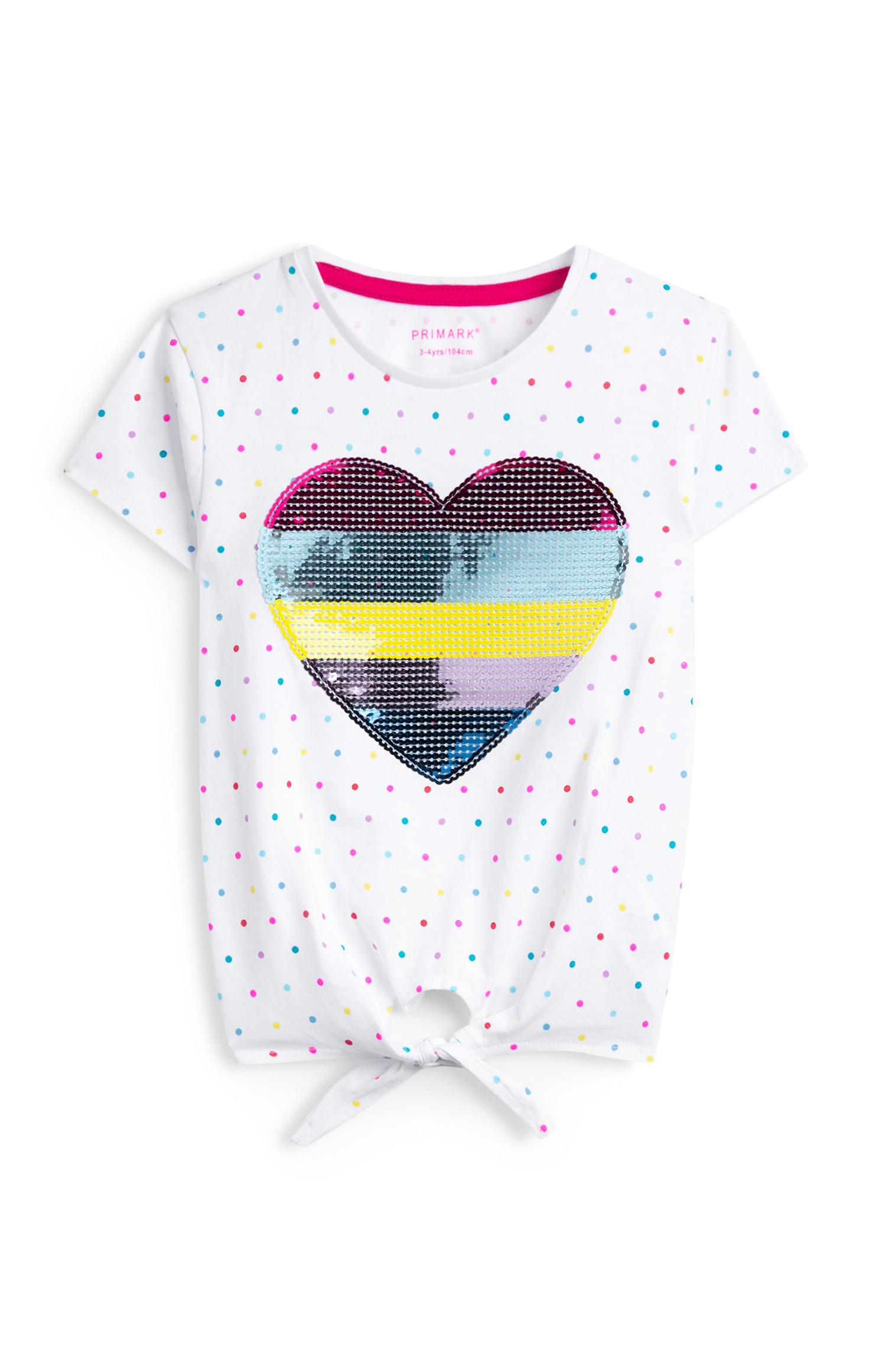 T-shirt bianca con cuore con paillettes e nodo sul davanti da bambina