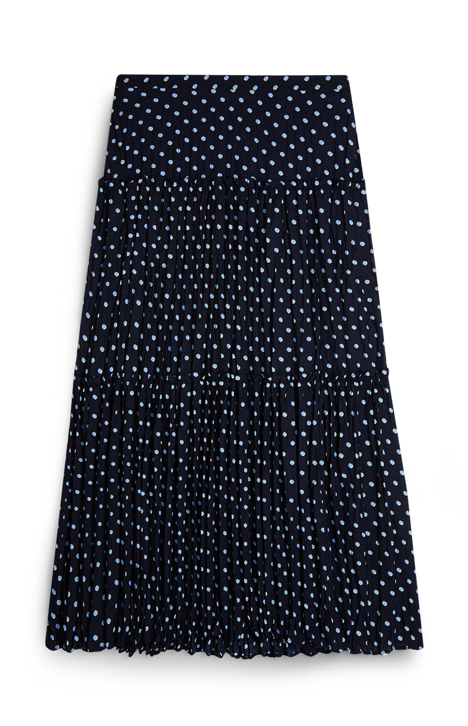 Jupe mi-longue noire et blanche à pois