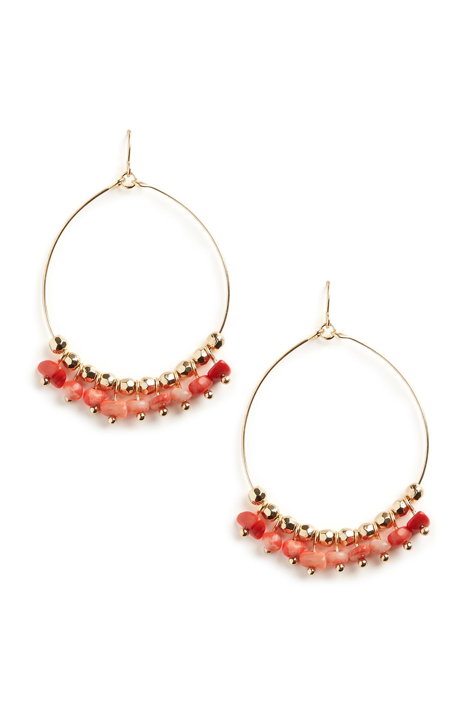 Boucles d'oreilles circulaires rouges à perles