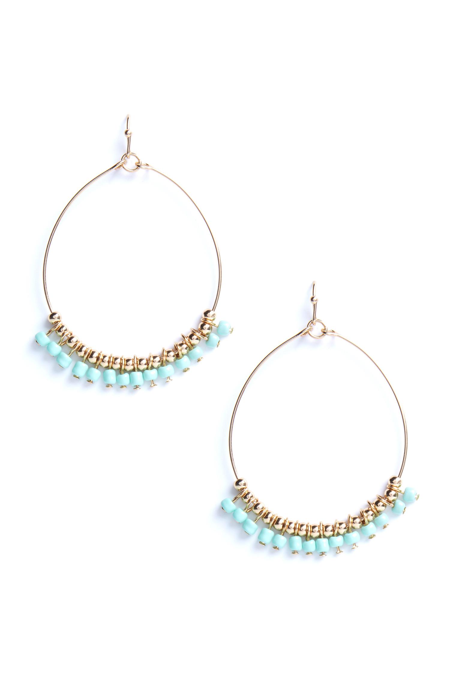 Pendants d'oreilles circulaires à perles bleues