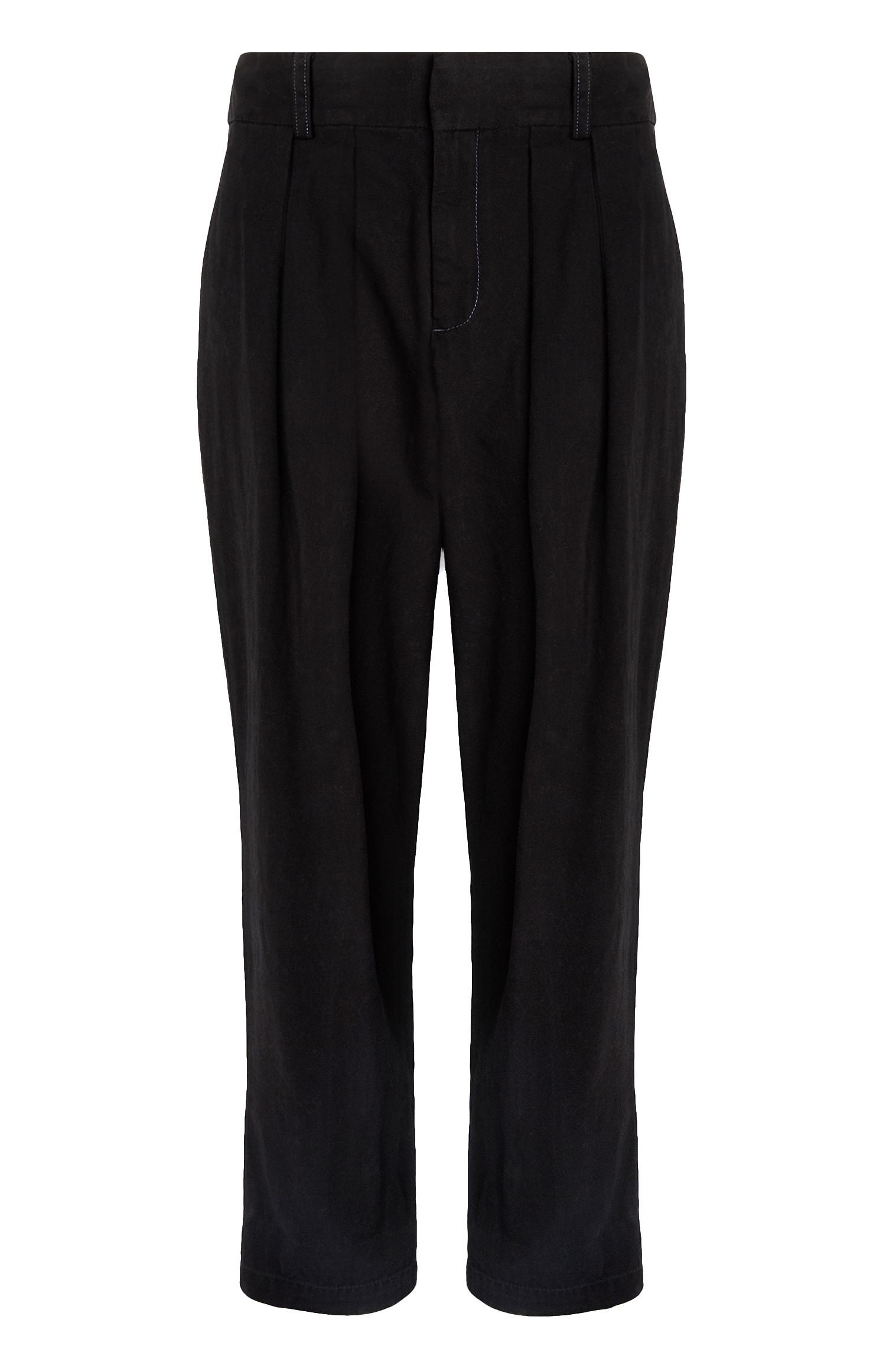 Pantalon bouffant noir plissé sur le devant