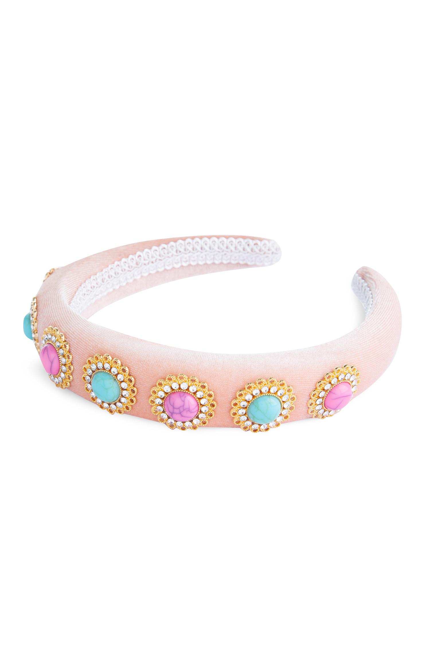 Cerchietto rosa per capelli con decorazioni