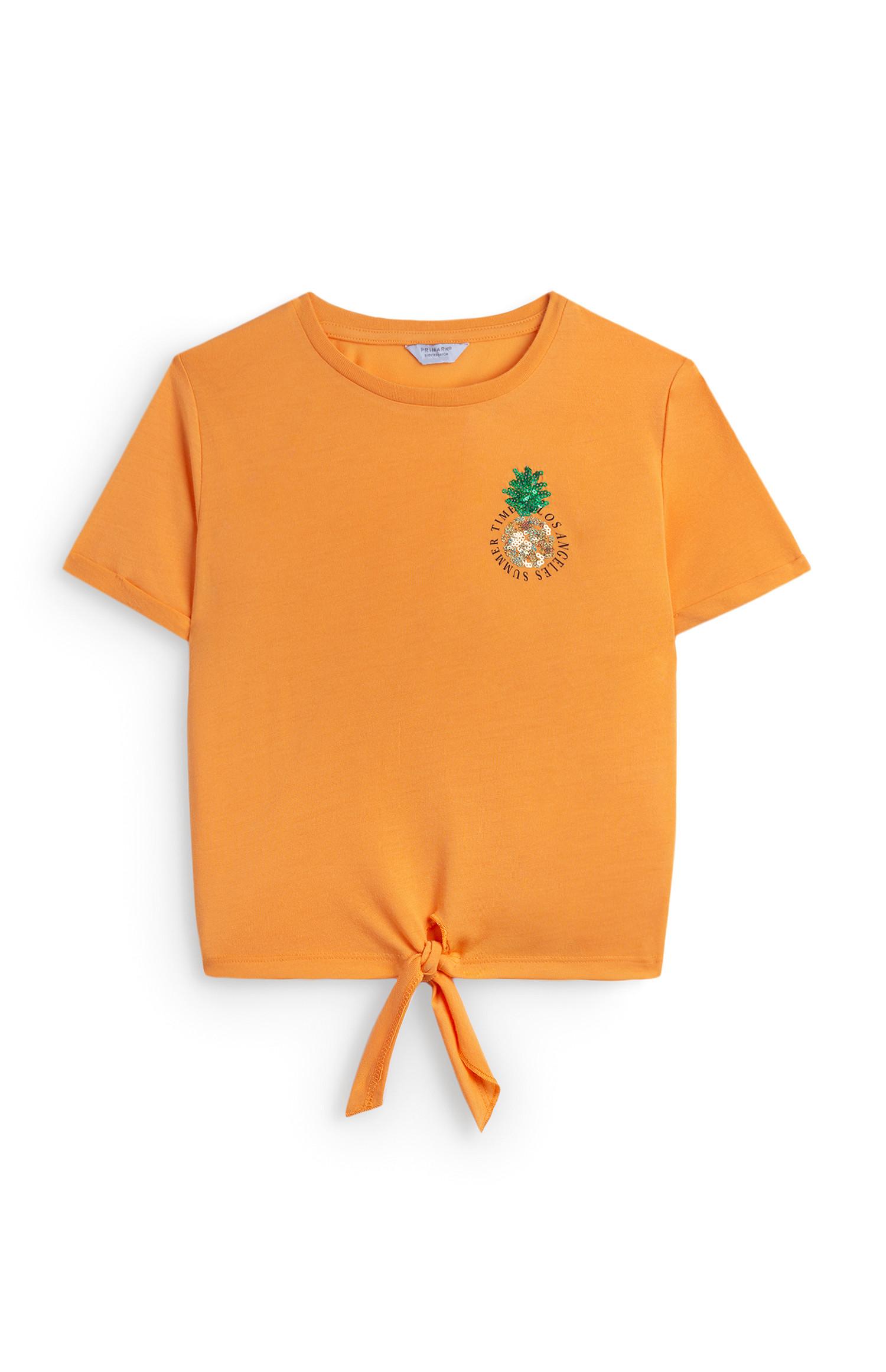 T-shirt arancione con applicazione ananas da ragazza