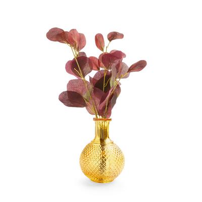 Vase ambré avec feuilles d'eucalyptus artificielles