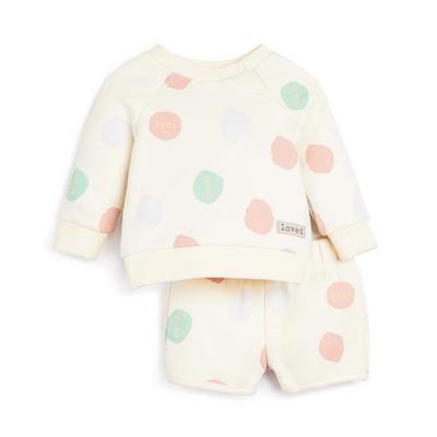 Conjunto de sudadera con cuello redondo y pantalón corto color crema con estampado de lunares para bebé