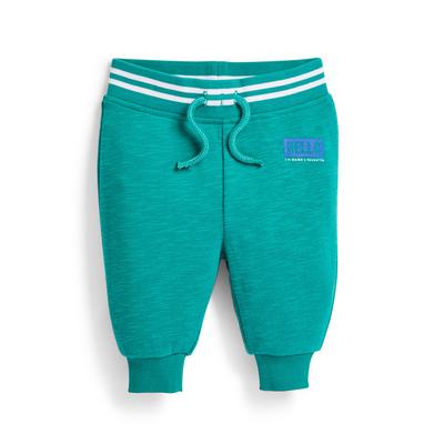 Pantalón de chándal verde azulado con mensaje para bebé niño