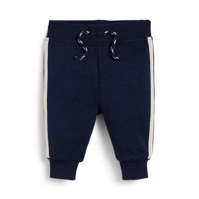 Pantaloni tip jogger bleumarin cu dungi laterale pentru băieței bebeluși