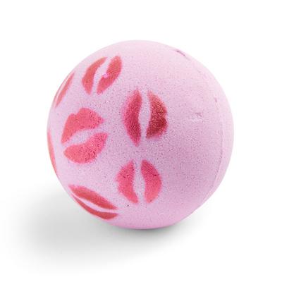 Rosafarbene Badekugel mit eingeprägtem Lippenmuster