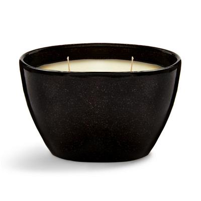 Kerze in schwarzem, ovalem Gefäß aus Keramik