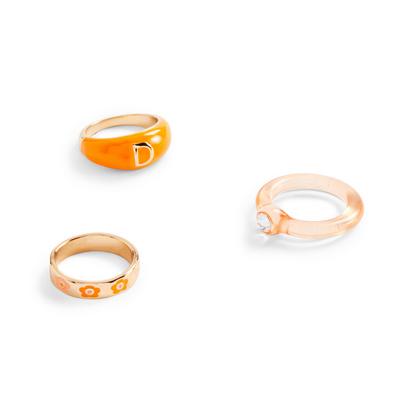 Set de 3 anillos dorados y de color naranja con iniciales surtidos