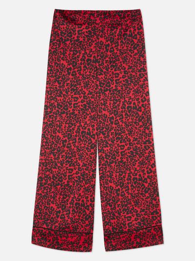 Calças pijama cetim corte perna larga padrão leopardo